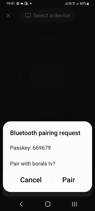 Bluetooth pairing request on TV Remote app visible on Android smartphone. 